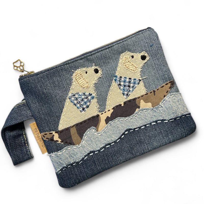 The Pupperfish Two golden retrievers floating in a boat on a lake. Upcycled denim. Handmade zipper pouch.