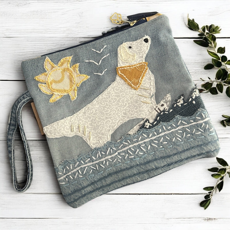 The Pupperfish Golden retriever surfing, hand embroidered on upcycled denim.