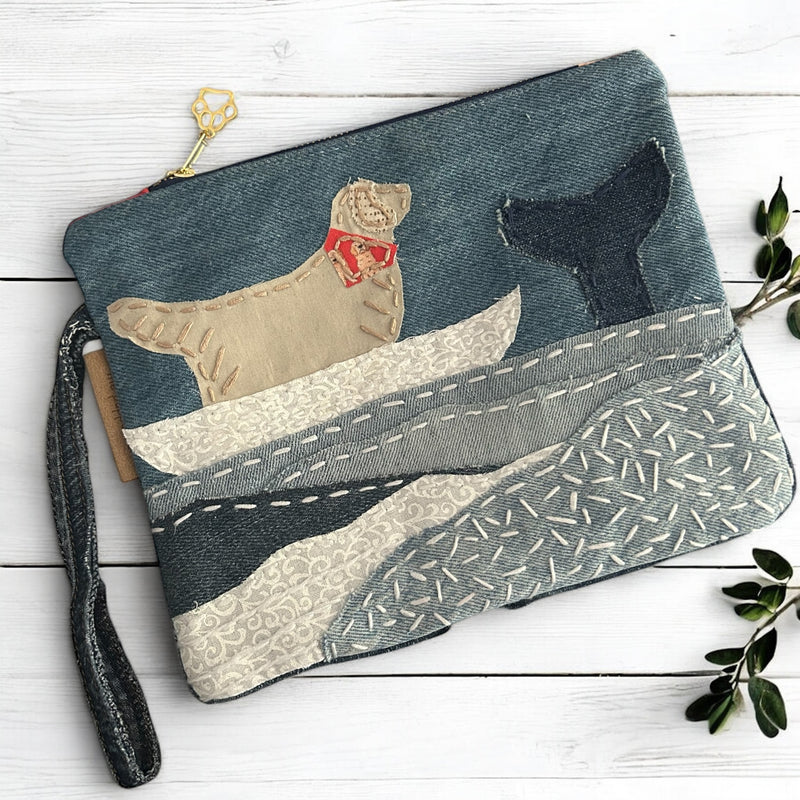 The Pupperfish Golden retriever on a whale watch in a boat, hand embroidered on upcycled denim.