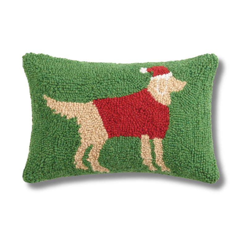 The Pupperfish Decorative pillow with a golden retriever wearing a red sweater and Santa hat on a green background