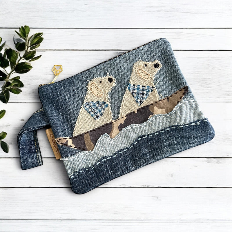 The Pupperfish Two golden retrievers floating in a boat on a lake. Upcycled denim. Handmade zipper pouch.